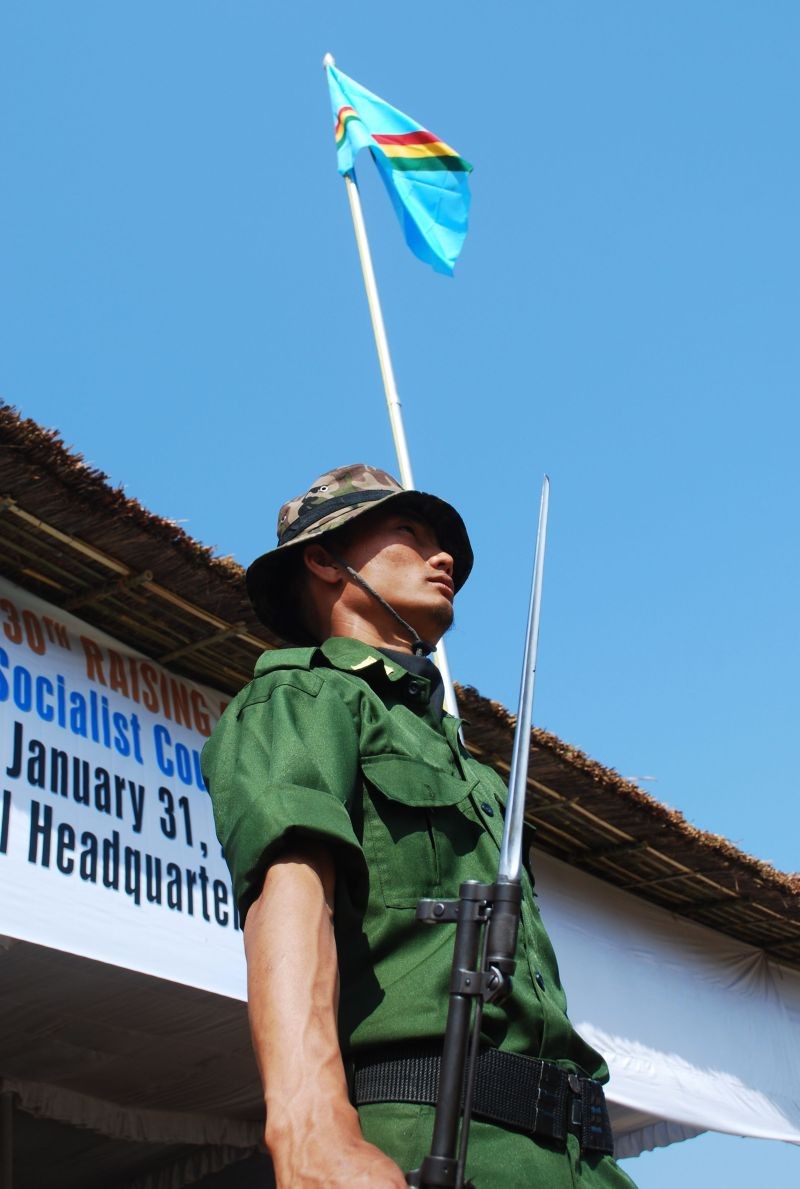 In this file photo, a cadre of NSCN (IM) stands guard beneath a Naga Flag during one of its Raising Day (January 31) at the Council Headquarter, Hebron. (Morung File Photo)